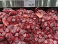 Closeup of a bunch of bags of Mini Babybel Cheese in a store