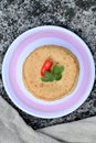 closeup the bunch brown color frayed tortilla with red chilly , green mint in the plastic plate with grey cloth soft focus natural Royalty Free Stock Photo