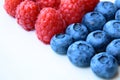 Closeup of a bunch of raspberries and blueberries Royalty Free Stock Photo