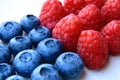 Closeup of a bunch of raspberries and blueberries Royalty Free Stock Photo