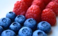 Closeup of a bunch of raspberries and blueberries Royalty Free Stock Photo