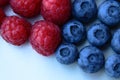 Closeup of a bunch of raspberries and blueberries Royalty Free Stock Photo