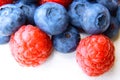 Closeup of a bunch of raspberries and blueberries Royalty Free Stock Photo