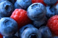 Closeup of a bunch of raspberries and blueberries Royalty Free Stock Photo