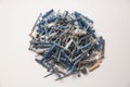 Closeup of a bunch of screws on a white background Royalty Free Stock Photo