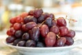 Closeup of a bunch of sweet, juicy grapes on a white plate