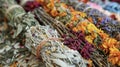 A closeup of a bundle of dried herbs and flowers representing the wisdom of generations of indigenous healers and their