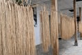 Closeup of bundles of rice straw hanging out to dry