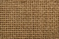 Burlap fabric texture with coarse jute weave and warm tan Royalty Free Stock Photo