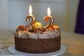 Closeup of burning birthday candles number 32 on a cake Royalty Free Stock Photo
