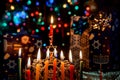 Closeup of a burning Chanukah candlestick with candles Menorah