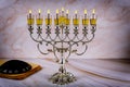 Closeup of a burning Chanukah candlestick with candles Menorah Royalty Free Stock Photo