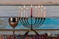 Closeup of a burning Chanukah candlestick with candles Menorah