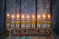 Closeup of a burning Chanukah candlestick with candles Menorah