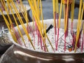 Closeup burning incense sticks in temple