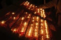 Closeup of the burning votive candles in Notre-Dame de Paris Cathedral