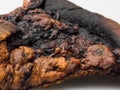 Closeup burnt slice of pizza Royalty Free Stock Photo