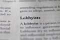 Closeup of Business legal term Lobbyist printed in textbook on white page. Royalty Free Stock Photo