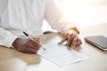 Closeup, business and man with a document, writing and insurance with a pen, planning and form. Zoom, person and Royalty Free Stock Photo