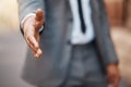 Closeup, business man and offer handshake for introduction, meeting and hello for networking in city. Worker stretching Royalty Free Stock Photo