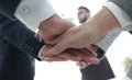 Business people folding their hands together. Royalty Free Stock Photo