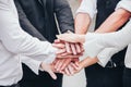 Closeup business people join hand together for unity teamwork group and diversity cooperation success team Royalty Free Stock Photo