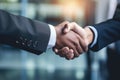 Closeup of business people shaking hands in office. Business concept, Businessman handshake in a close-up shot, top section Royalty Free Stock Photo