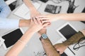 Closeup of business team putting their hands on top of each other Royalty Free Stock Photo