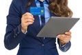 Closeup on business woman with credit card using tablet pc Royalty Free Stock Photo