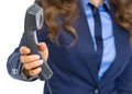 Closeup on business woman giving phone handset Royalty Free Stock Photo