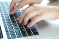 Closeup of business woman hand typing