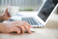 Closeup of business woman hand typing on laptop keyboard