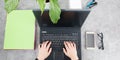 business woman hand typing on laptop keyboard with smartphone and glasses in fast lay Royalty Free Stock Photo