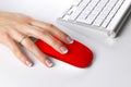 Closeup of business woman hand using wireless computer mouse and keyboard. Royalty Free Stock Photo