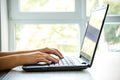 Closeup of business woman hands typing on laptop keyboard Royalty Free Stock Photo