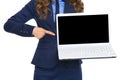 Closeup on business woman pointing on laptop blank screen Royalty Free Stock Photo