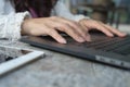 Closeup business woman hands typing on laptop keyboard on desk. Royalty Free Stock Photo