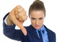 Closeup on business woman showing thumbs down