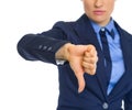 Closeup on business woman showing thumbs down