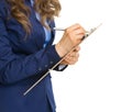 Closeup on business woman writing in clipboard Royalty Free Stock Photo