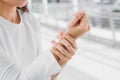 Closeup business women holding rub her wrist pain