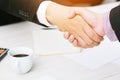 Closeup of a businessman hand shake businesswoman between two colleagues OK, succeed Royalty Free Stock Photo