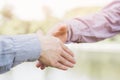 Closeup of a businessman hand shake businesswoman between two colleagues OK, succeed Royalty Free Stock Photo