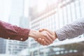 Closeup of a businessman hand shake businesswoman between two colleagues OK, succeed Royalty Free Stock Photo