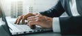 Closeup of businessman hands typing on laptop computer in office. banner Royalty Free Stock Photo