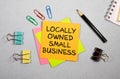 card with text LOCALLY OWNED SMALL BUSINESS, business concept image Royalty Free Stock Photo