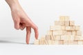 Closeup of businessman making a pyramid with empty wooden cubes Royalty Free Stock Photo