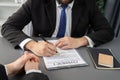 Closeup businessman sign contract with a pen in his hand. Equilibrium Royalty Free Stock Photo