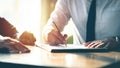 Closeup Businessman signing a contract investment professional document agreement on the table with pen.