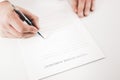 Businessman signing an Patent License Agreement contract with a pen